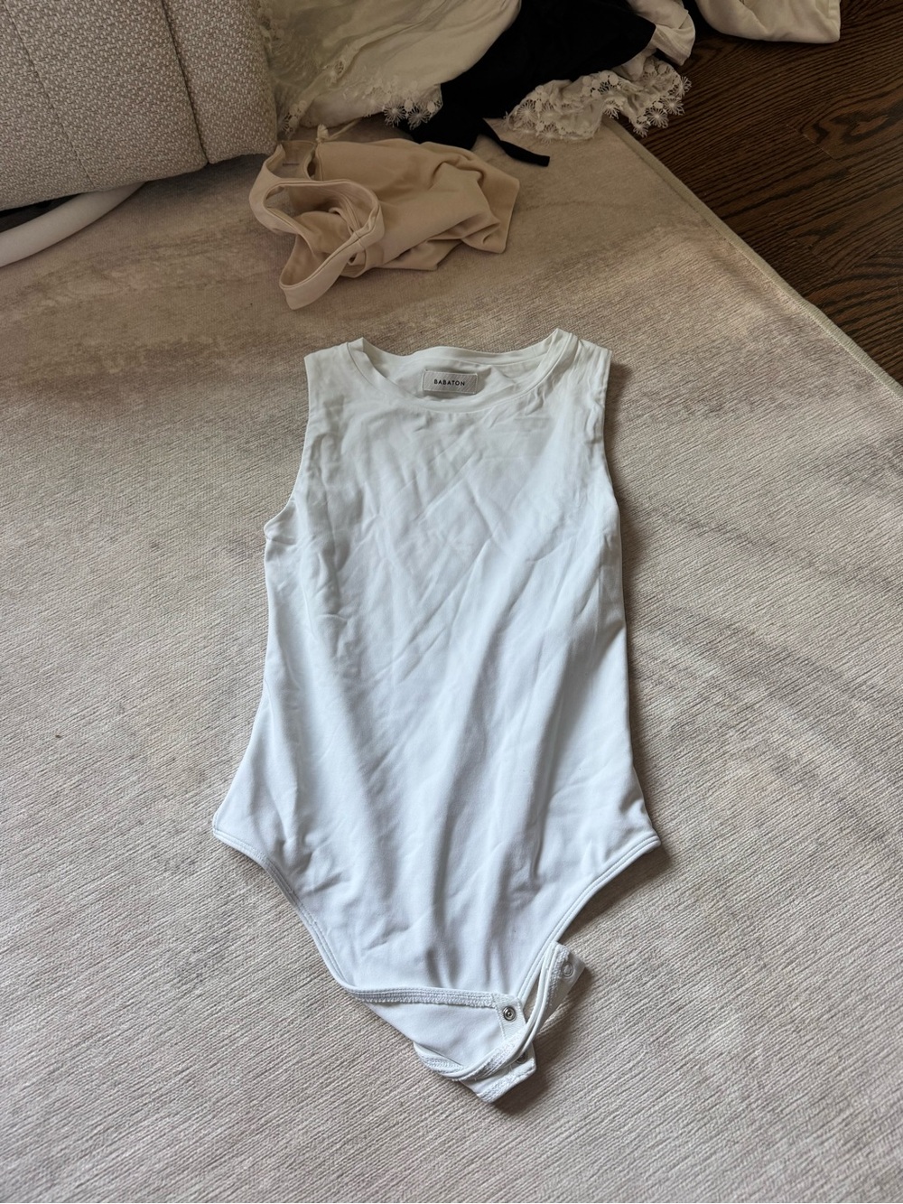 Aritzia White Sleeveless One-Piece Bodysuit